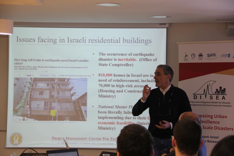 Igal Shohet presenting his work in the Workshop on Modeling Urban Resilience in the Aftermath of the Haifa Fire